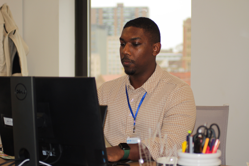 Marcus Robinson sits at his desk, working.